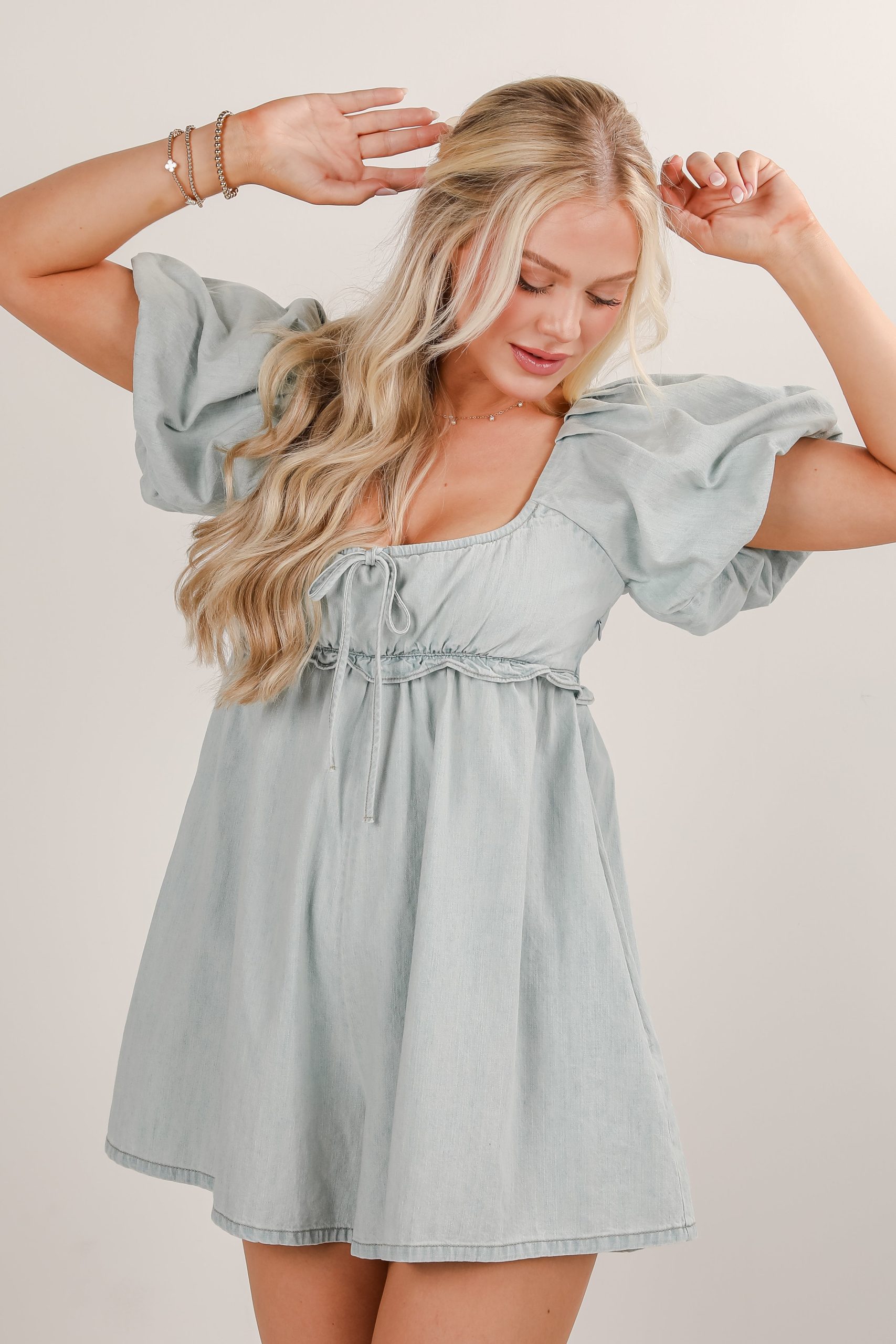 shopdressup_light_wash_denim_romper_43214fae-33b7-4a49-8145-5b76f7d3f0ad.jpg